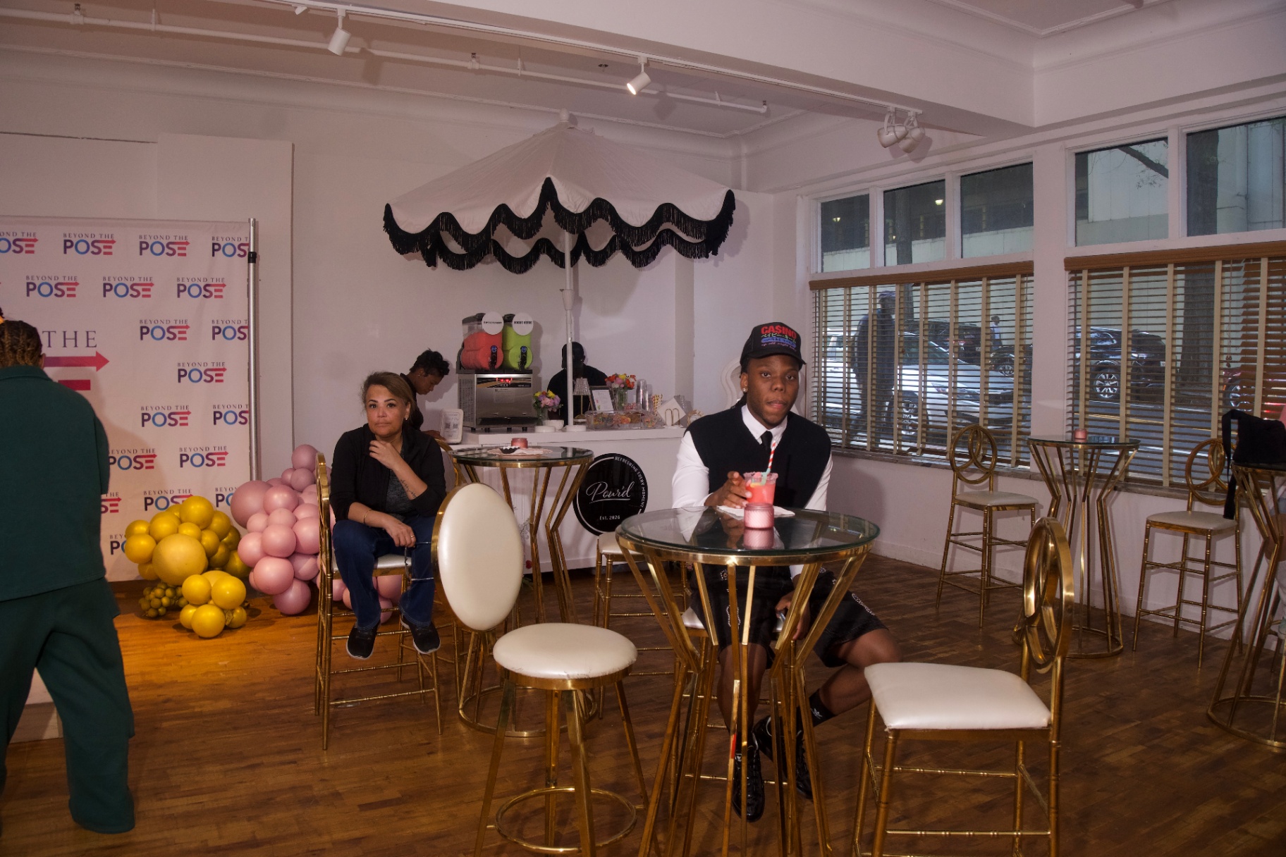 Guests relaxing at the Pour'd cocktail lounge