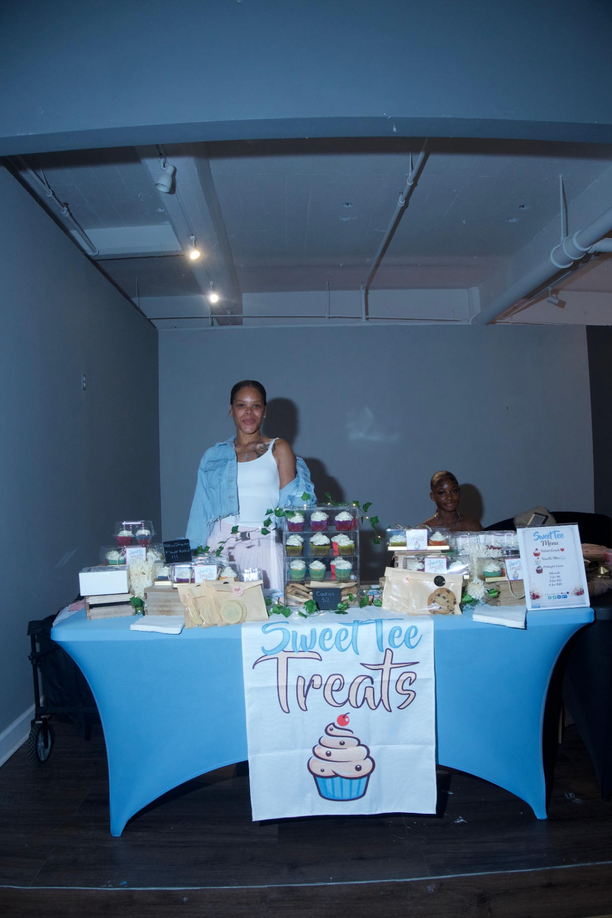 Sweet Tee Treats vendor booth with cupcakes and cookies