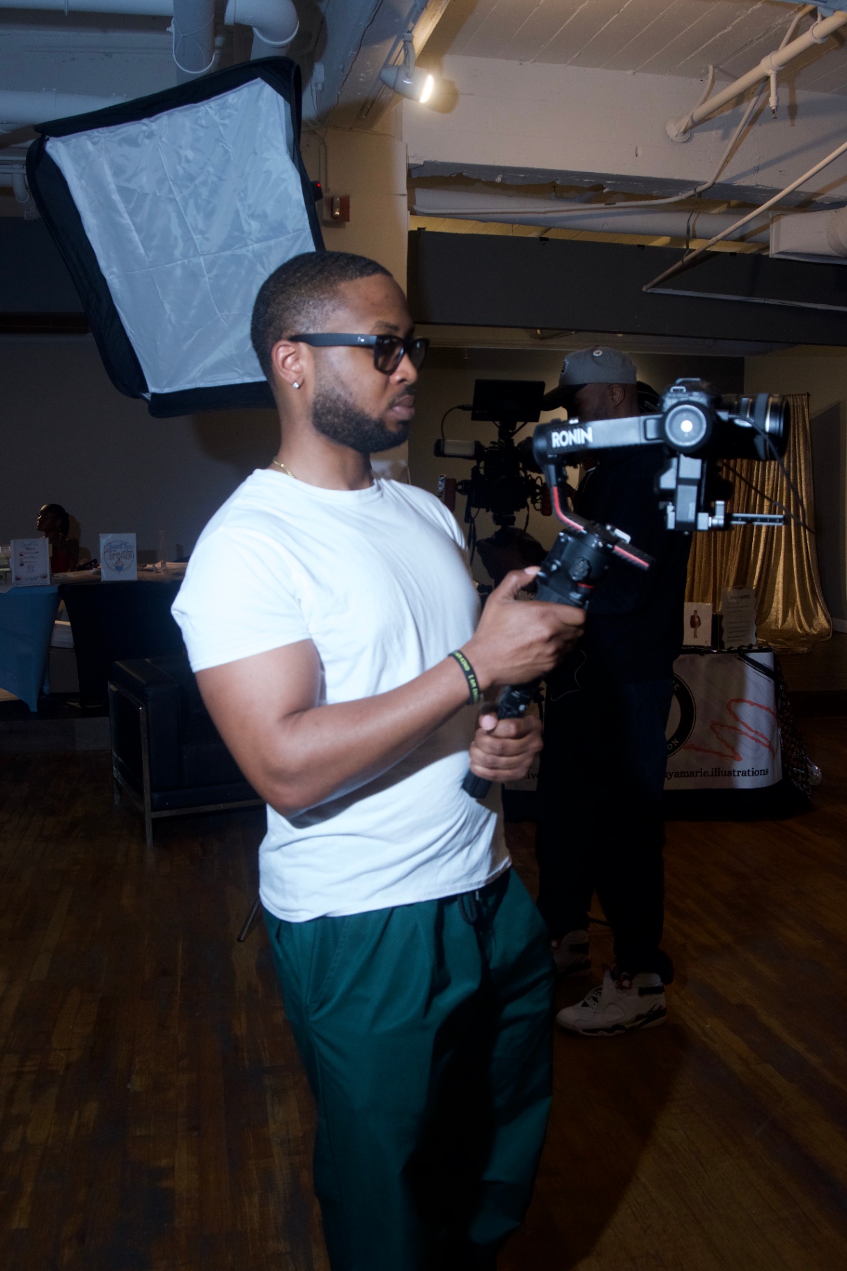 Videographer with a Ronin gimbal capturing behind the scenes